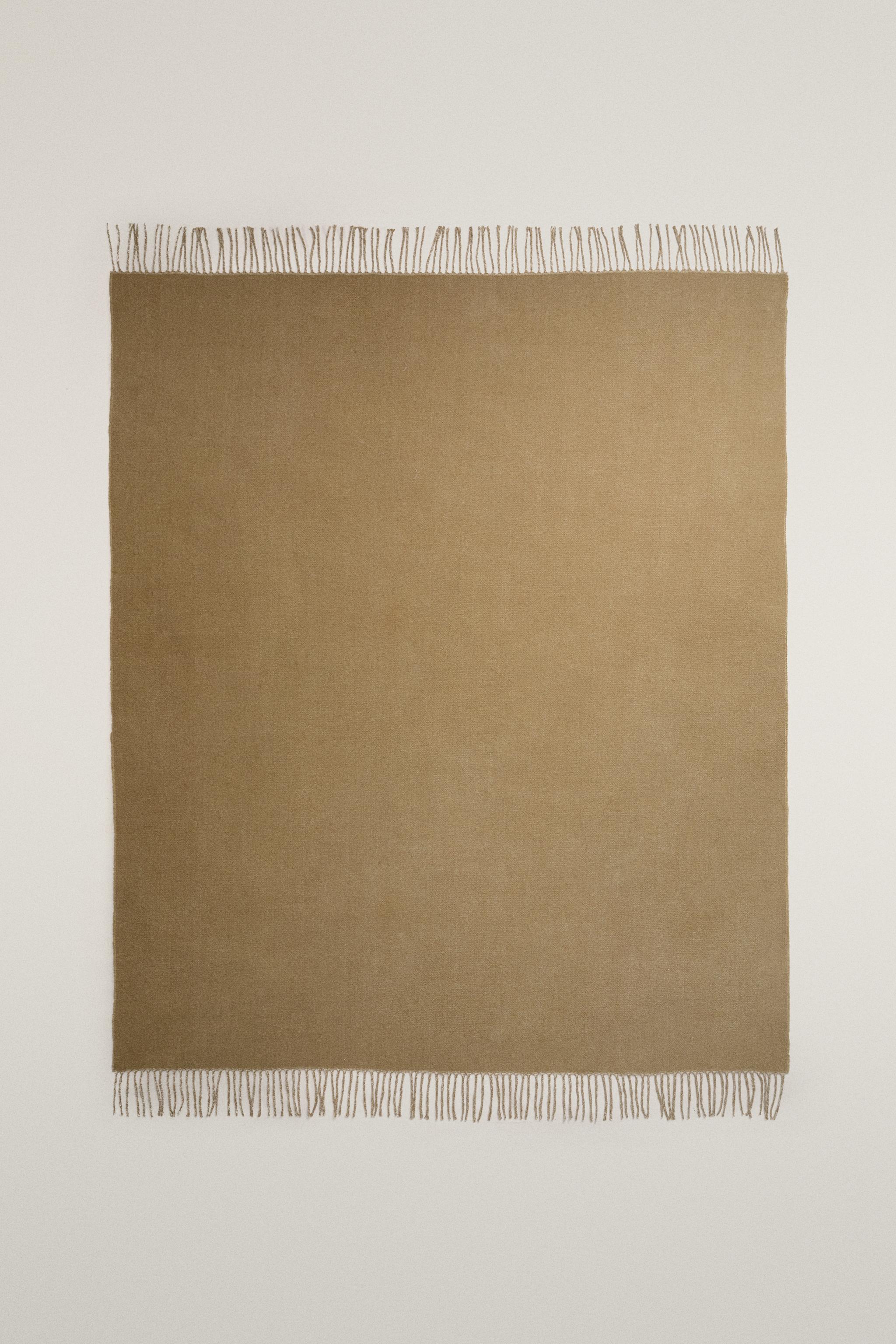 COUVERTURE DOUCE À FRANGES